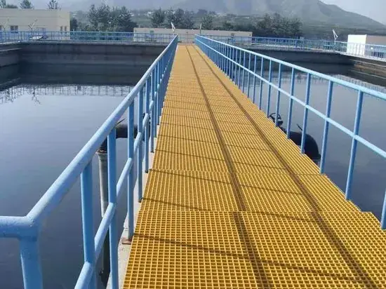 Grit-top FRP grating fan-deck walkway over a cooling tower water basin