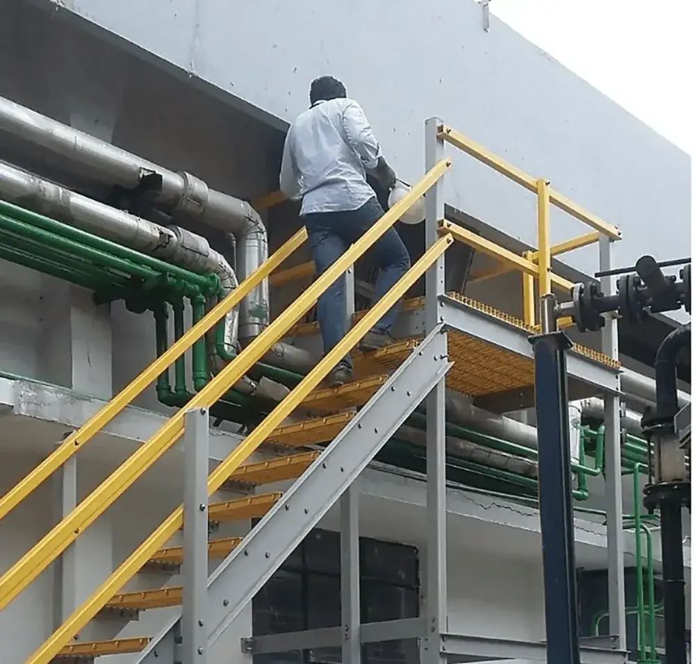 FRP grating access platform and stairs around industrial and telecom equipment
