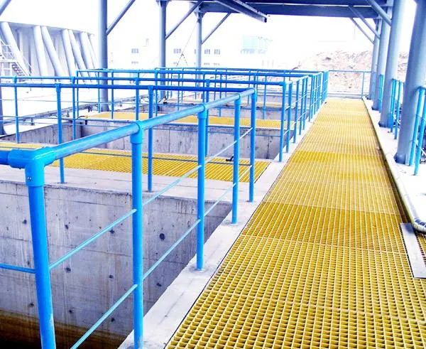 FRP grating walkway above a concrete process basin in a chemical facility