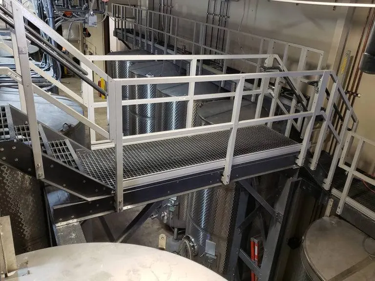 FRP grating platform and stair access around stainless steel fermentation tanks